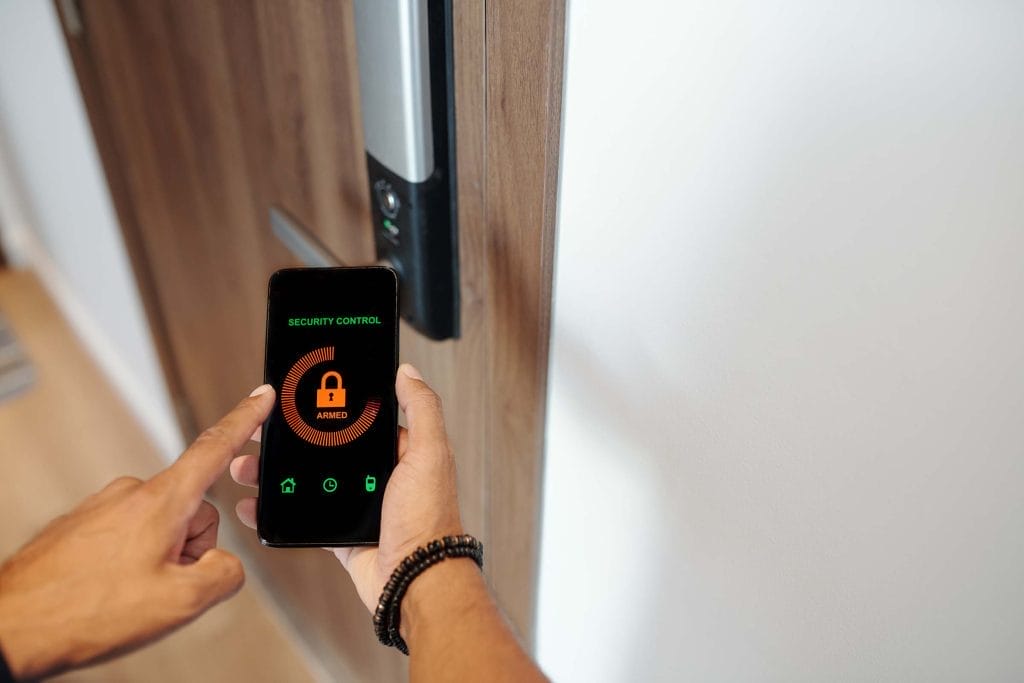A men opening the door using smartphone